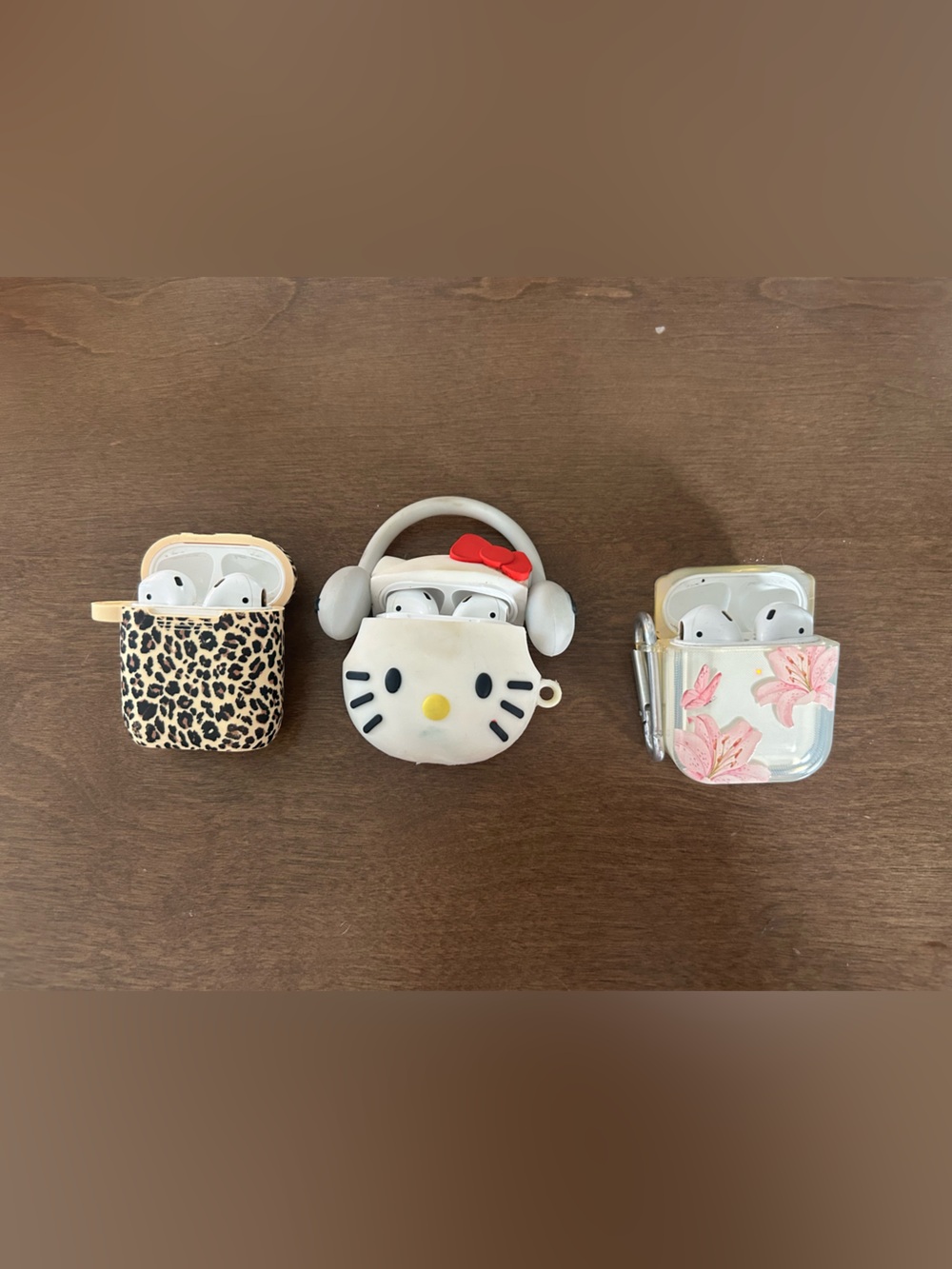 3 pairs of airpods with cases